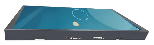 Open-frame display module lying flat, showing the panel and its metal chassis edge from a low angle