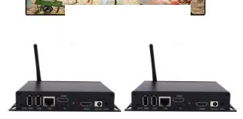 Two compact black digital signage media players with wireless antennas, seen from the front connector side