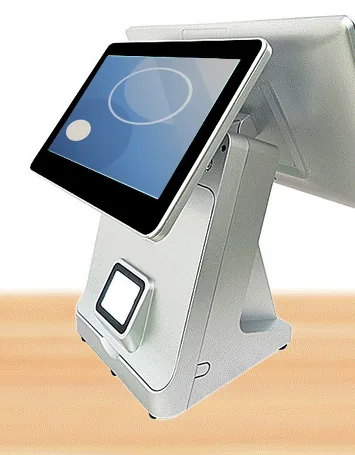 White dual-screen countertop terminal with a customer-facing touchscreen, a rear operator display and a scanner window in the base