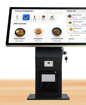 Black countertop ordering kiosk with a tilted landscape touchscreen on a column housing a printer, standing on a flat foot plate