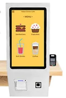 White wall-mounted ordering kiosk with a portrait touchscreen, printer slot and scanner window, and a small card terminal fixed to its right side