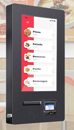 Black deep-bodied outdoor wall-mounted payment kiosk seen at an angle, with a portrait touchscreen, ticket slot and small card reader