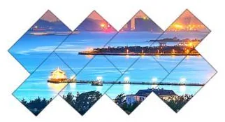 Creative video wall layout of nine diamond-rotated panels arranged in a staggered mosaic showing one skyline picture